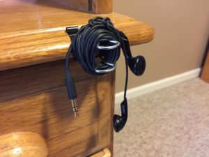 Use a Binder Clip to Store Your Earbuds During Meetings