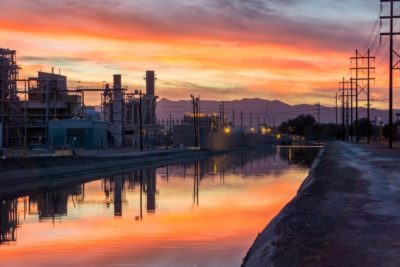 Power Plant at Sunset, Reflecting in a Narrow River