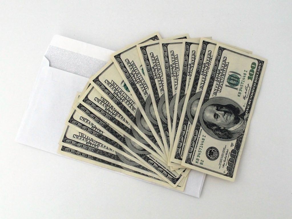Set of Dollar Bills With an Envelope